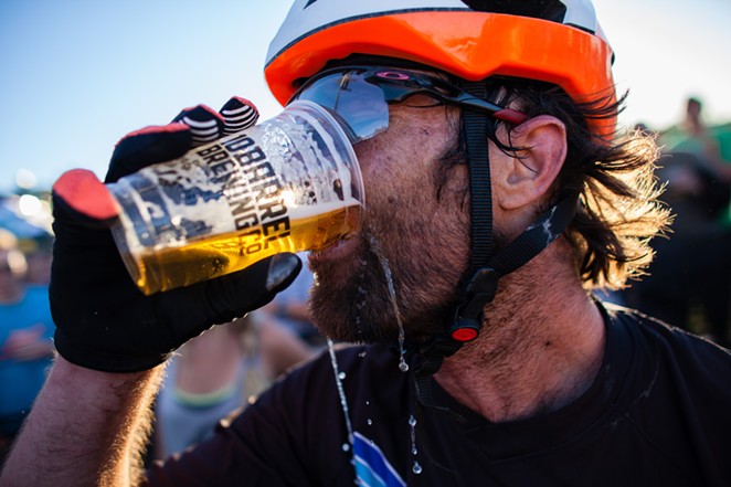Pro mountain bikers race to the finish where a pint of 10 Barrel beer awaits