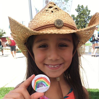 A visitor made her own Sisters Farmers Market button at the Kid Made Camp booth! Yay.