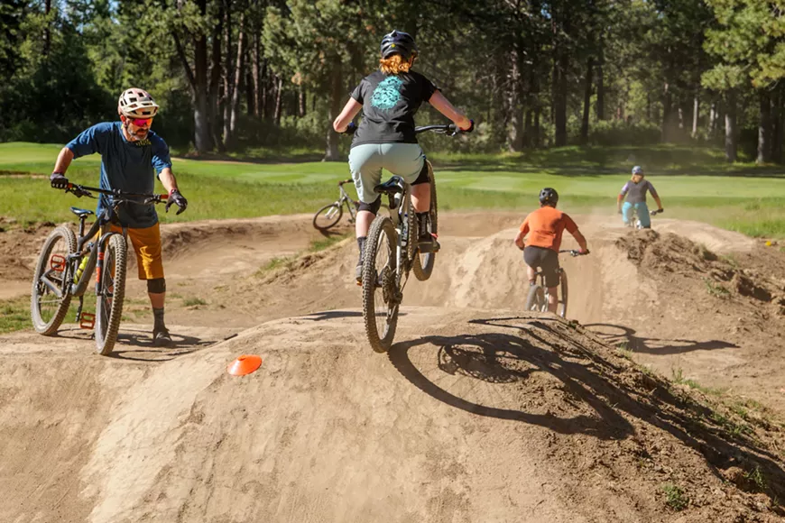 Mountain bike jump instruction for adults.