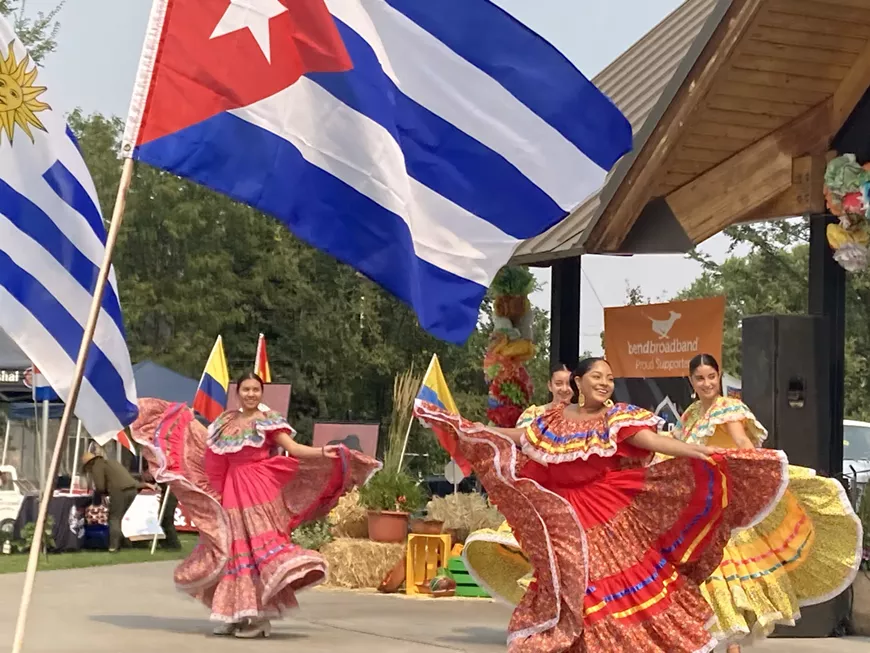 Dancers perform under Latin American flags at Latino Fest 2022.
