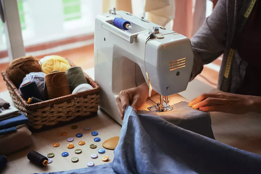 using-a-sewing-machine-scaled.webp