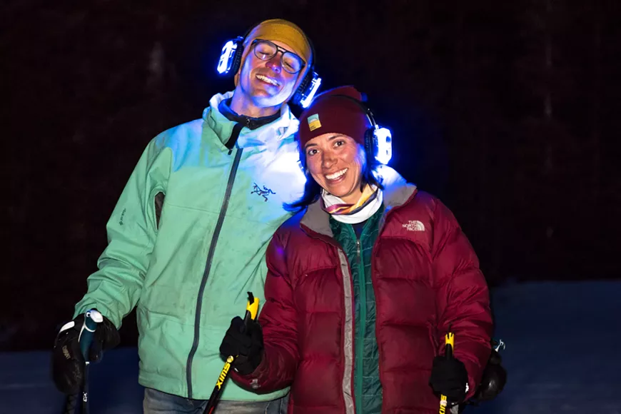 Happy concert goers listening to the concert while skiing