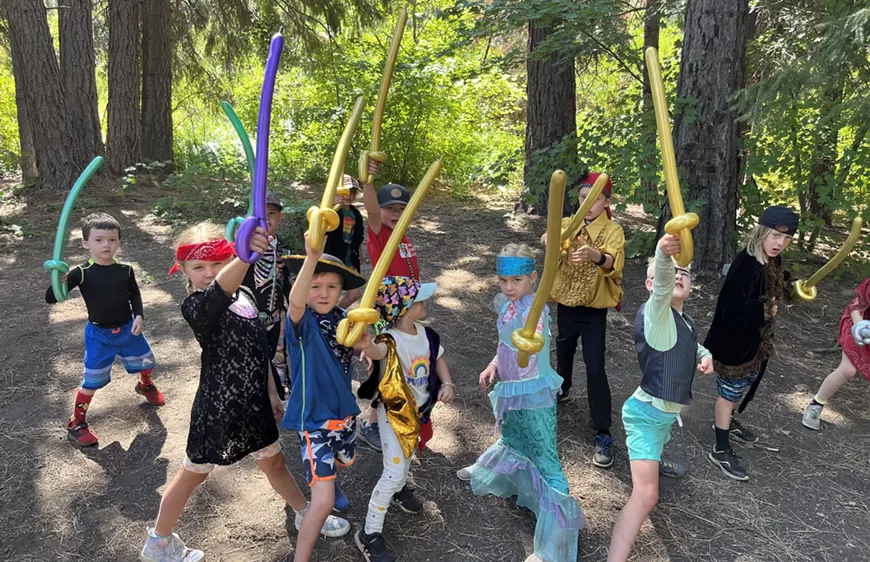 Starshine pirate Imagineers brandish their balloon swords