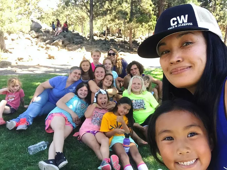 Camp Fire volunteer counselors having fun outdoors at camp